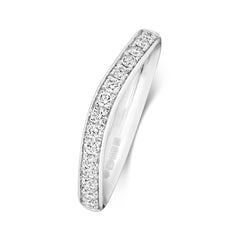 An angled side view of a platinum or 18ct white gold wave ring, highlighting the elegant grain setting.