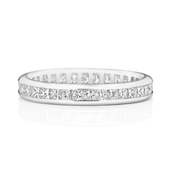 A front view of a channel set diamond eternity ring, highlighting the clean lines of the square princess cut stones.
